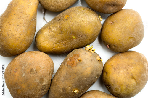 Close up potatoes over white background.