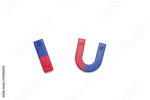 Bar magnet and horseshoe magnet over white background.