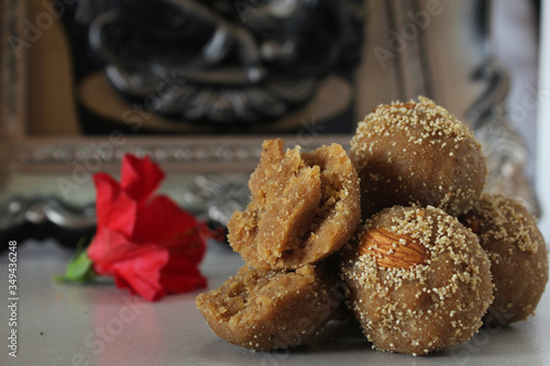 Churma ladoo[laddu]is Indian traditional sweet made with wheatflour,desi ghee and jaggery during Ganesh Chaturthi  auspicious occasions. photo