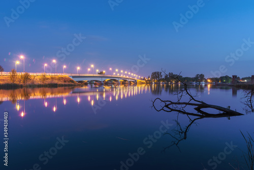 charming landscape on the river at sunset and night time