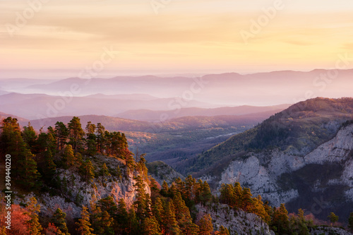 Rocky mountain valley at sunrise with a cloudy sky and fir trees. Big Thach Natural Park. krasnodar region, Russia