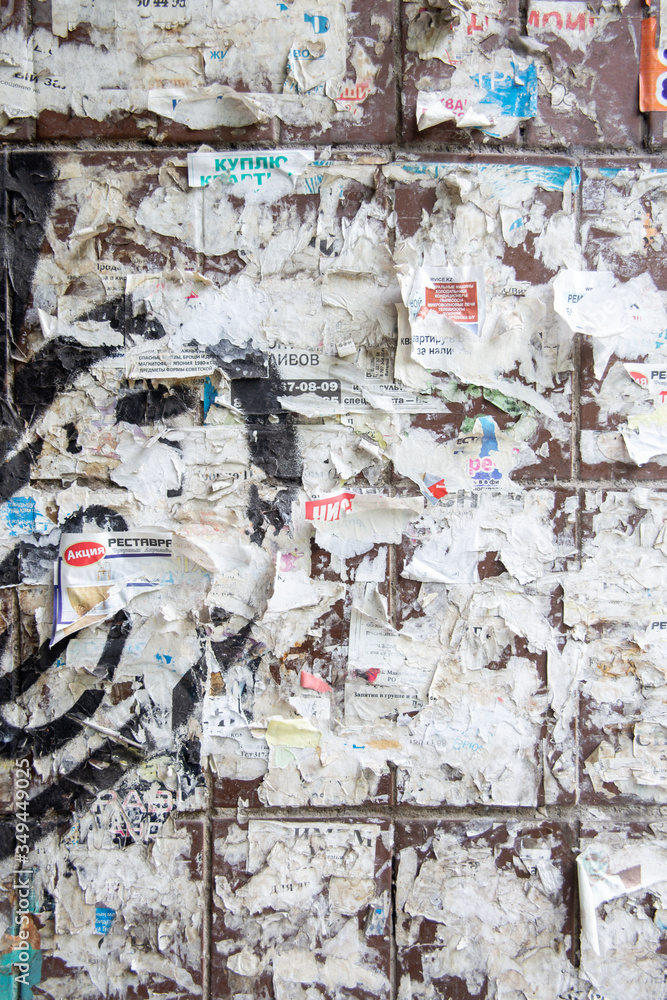 wall for announcements with old leaflets