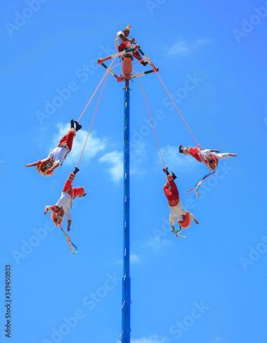 Tulum, Quintana Roo / Mexico
Papantla flyers performance, mexican culture concept photo