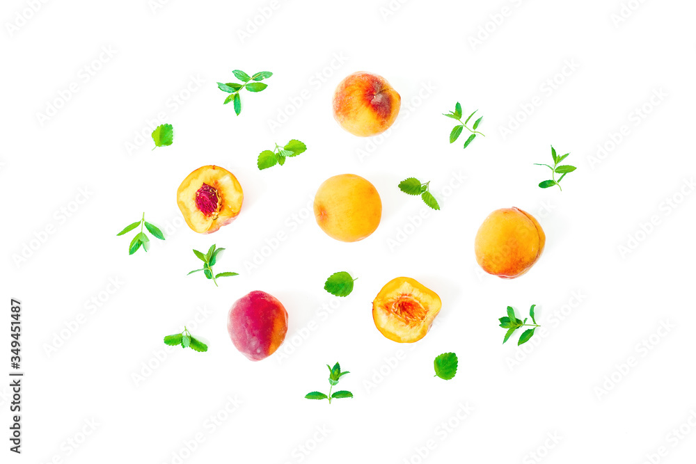 Ripe peaches with leaves isolated on white background. Summer fruits. Top view. Flat lay