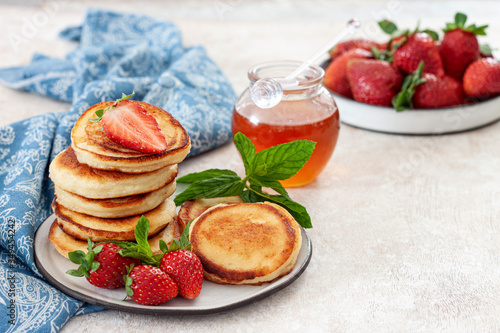 Pancakes with ricotta and fresh strawberries .Tasty breakfast
