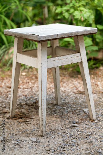 Wooden stool stands on ground
