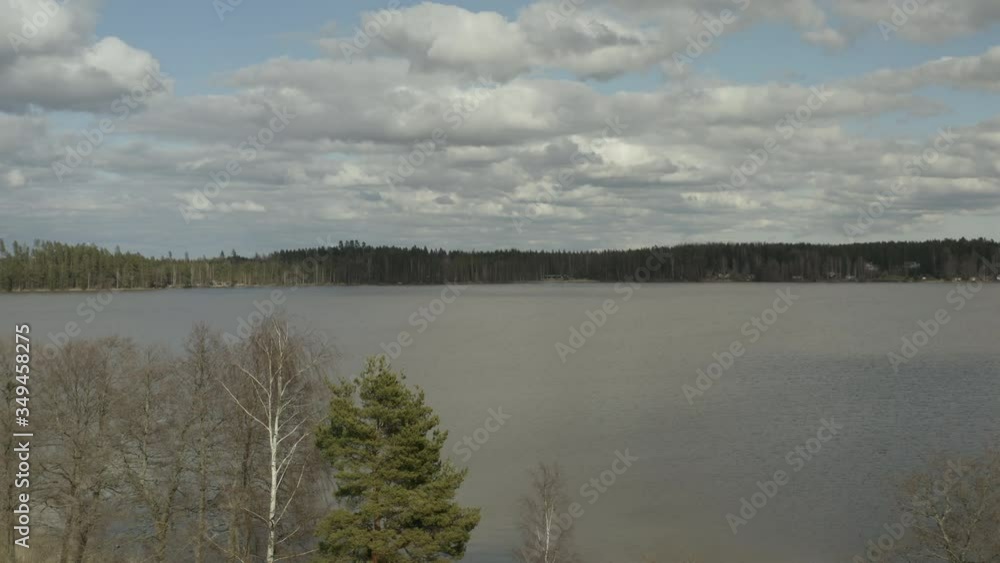Flying over green meadow and huge lake in sunny day. Flying over green meadow and huge lake in sunny day.