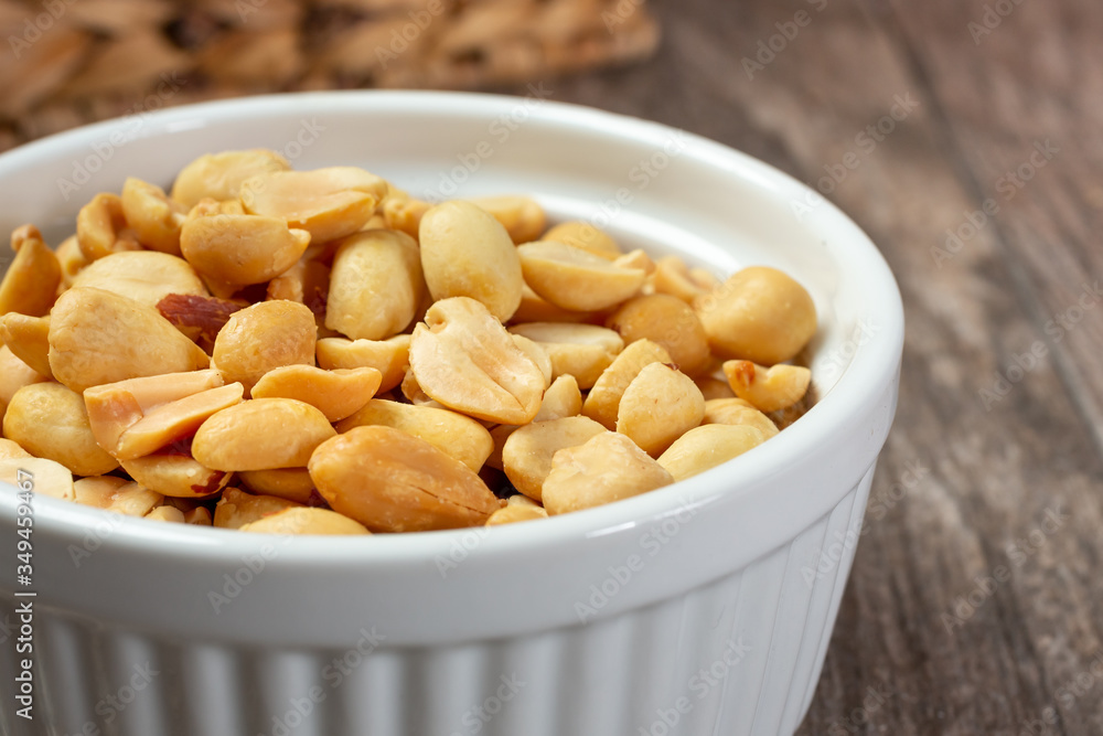 A closeup view of a bowl of peanuts. A closeup view of a bowl of peanuts.