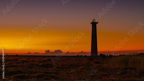 Lighthouse in the warm light of the sunrise