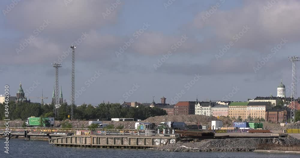 4K Helsinki Baltic Sea Finnish Bay lagoon, city panorama, boats sailing, fishermen in early summer morning video from Kalasatama and Mustikkamaa areas over calm water channel in Finland, Europe