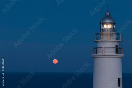 The lighthouse and the moon