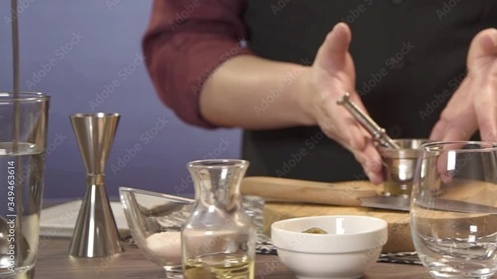 putting jar with muddler on chopping board - panning putting jar with muddler on chopping board - panning