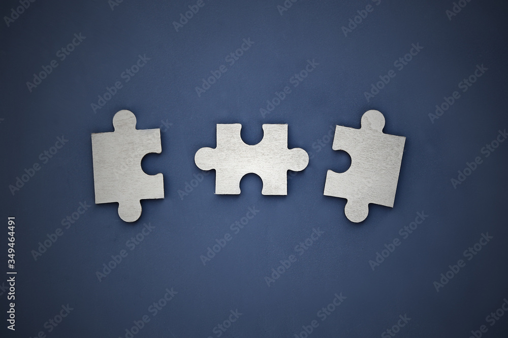 Obraz premium Puzzle on a dark background. Abstract, black