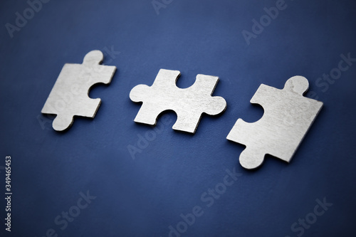 Puzzle on a dark background. Abstract, black