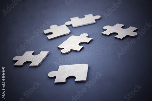 Puzzle on a dark background. Abstract, black