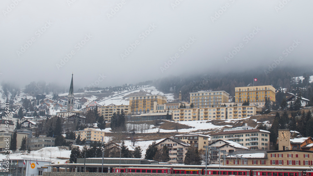 City of Saint Moritz  with bernina's train during winter