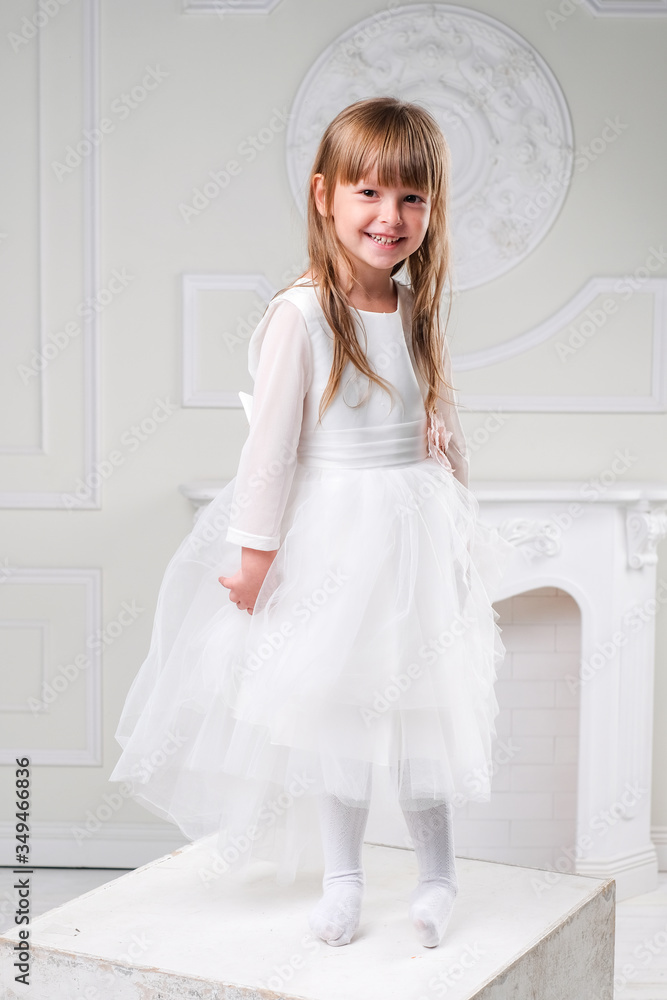 girl in a white dress laughs hand gestures girl in a white dress laughs hand gestures