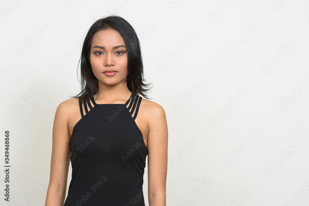 Portrait of young beautiful Asian businesswoman looking at camera Portrait of young beautiful Asian businesswoman looking at camera