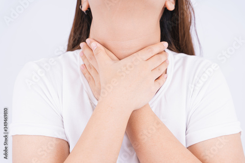 Wallpaper Mural Female touching acute throat pain on white background with copy space. Medical, healthcare for advertising concept. Torontodigital.ca
