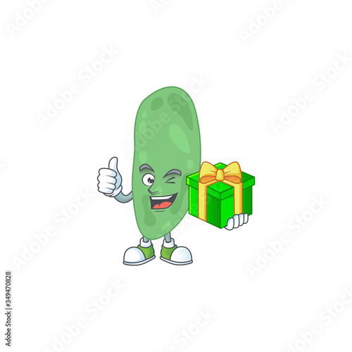 Happy smiley thermus thermophilus cartoon mascot design with a gift box