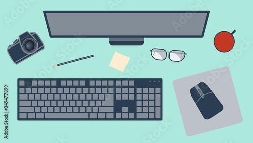 Workplace with monitor, keyboard, mouse, mouse pad, pencil, glasses and a camera. Vector flat illustration