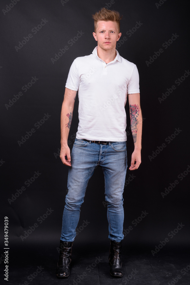 Full body shot of rebellious man as punk rocker Full body shot of rebellious man as punk rocker
