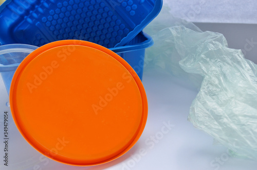 Orange lid, transparent and blue plastic container on a white background. chemist day. international climate day. World Hydrography Day photo