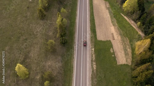  the car goes on a mountain road, shooting from a height

