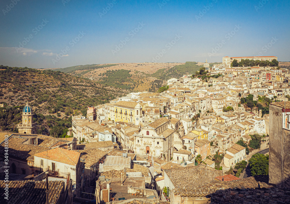 View of the historic city of Ragusa Ibla,Sicily, and the church of Santa Maria dell'Itria on the left and the church of Anime del Purgatorio on the center of this  old style photography (11/08/2019)