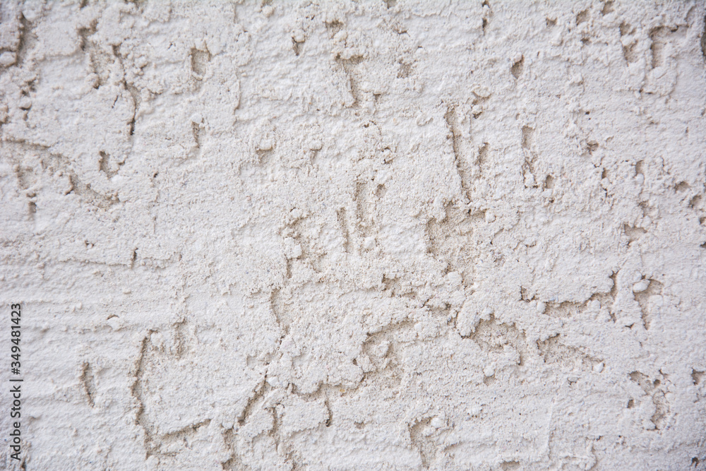 Background image of Stucco wall with hand-made decorative plaster. Texture of gray decorative plaster or concrete. Copyspace for design.