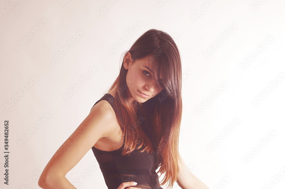 Fototapeta premium Profile portrait of a young model with brown hair