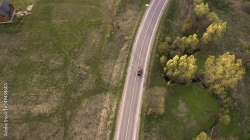  the car goes on a mountain road, shooting from a height
