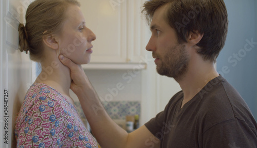 Angry man strangling his wife