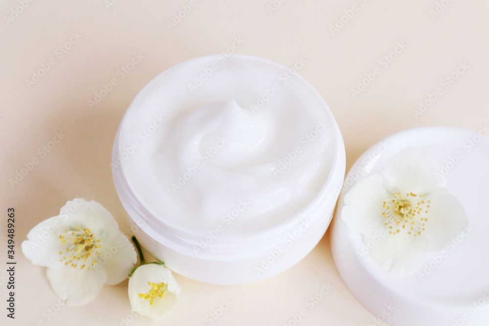 Cream moisturizer in the white jar. The concept of health and beauty.
