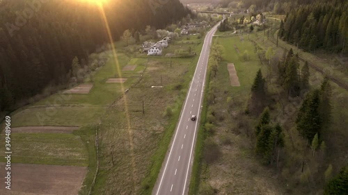  the car goes on a mountain road, shooting from a height
