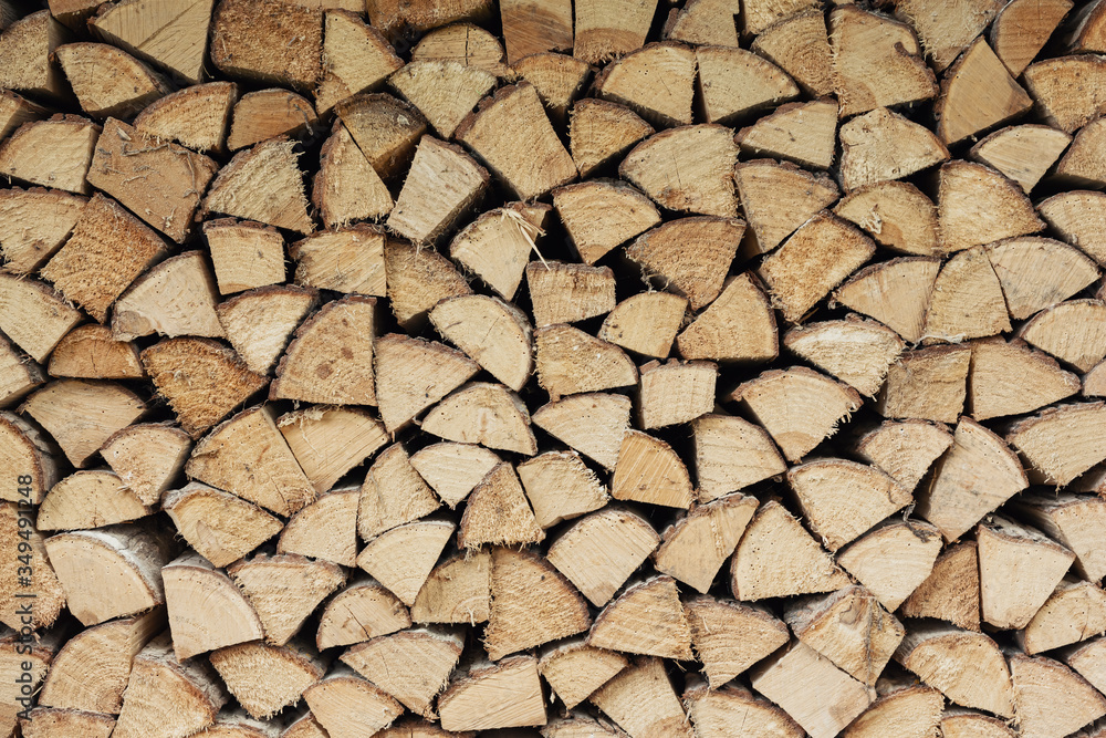 Precisely layered pile of wood from different cut firewood, heating material, sustainable reforestation Precisely layered pile of wood from different cut firewood, heating material, sustainable reforestation