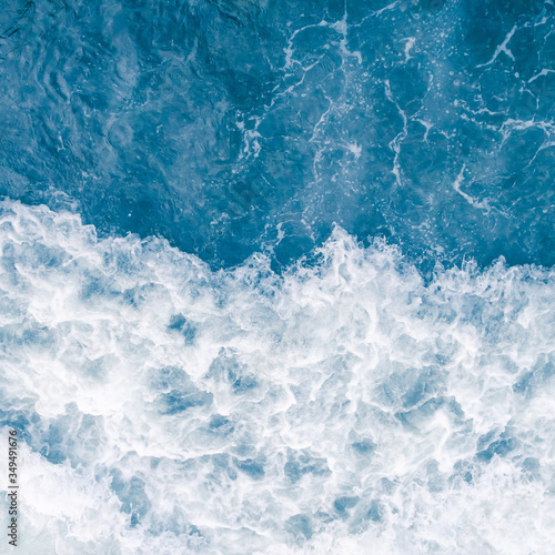 Pale blue sea wave during high summer tide, abstract ocean background