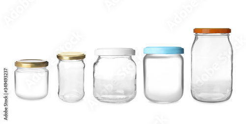 Set with closed empty glass jars on white background. Banner design