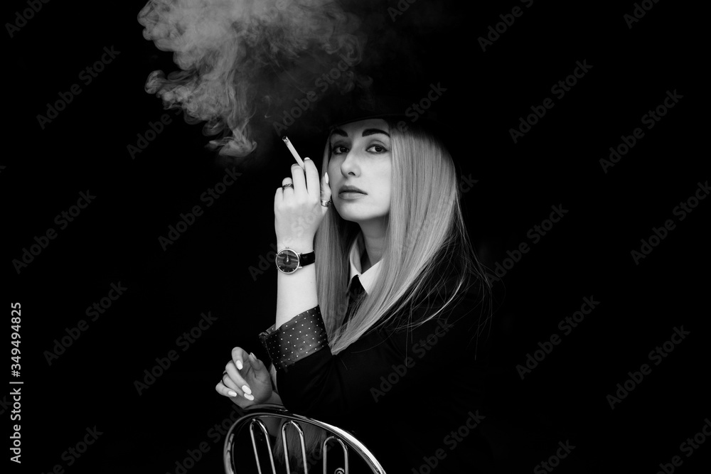 Φωτογραφία Elegant woman smoking, cinema style, artistic commercial photo for some campaign