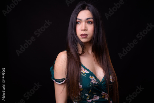 Face of young beautiful Asian transgender woman photo