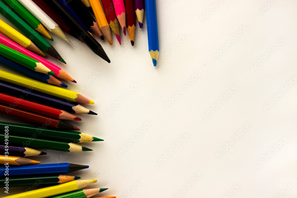 colored pencils on a wooden background colored pencils on a wooden background