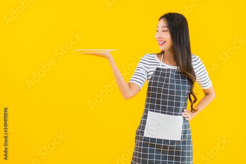 Portrait beautiful young asian woman with white dish or plate