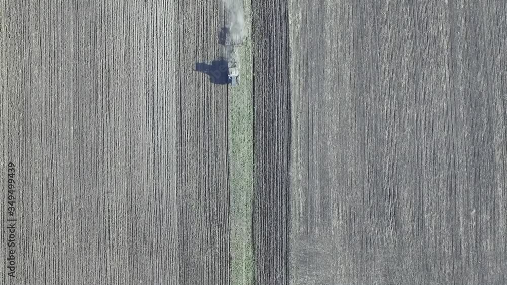 spring plowing, tractors plow the field after winter spring plowing, tractors plow the field after winter