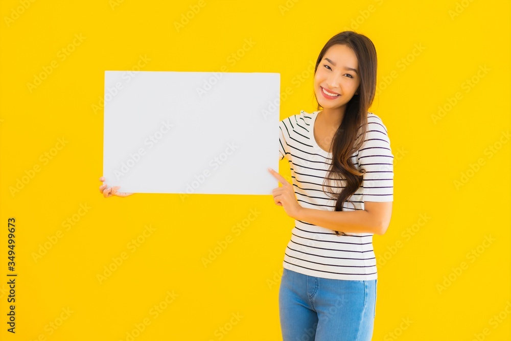 Portrait beautiful young asian woman show empty white billboard sign