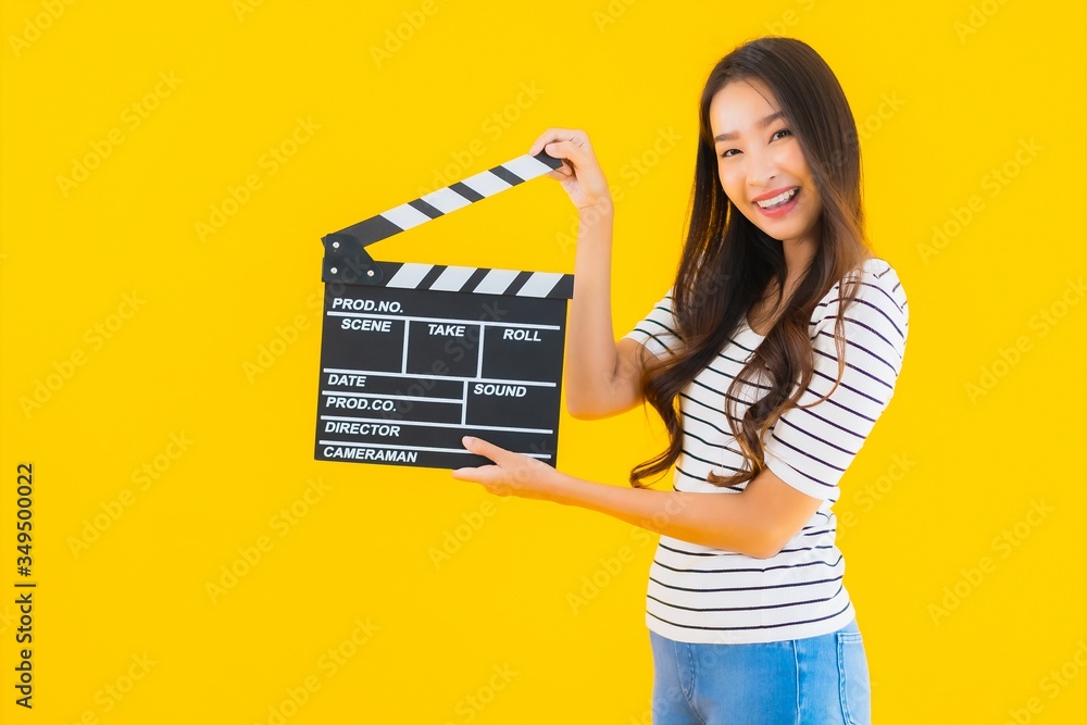 Portrait beautiful young asian woman show clapper movie board