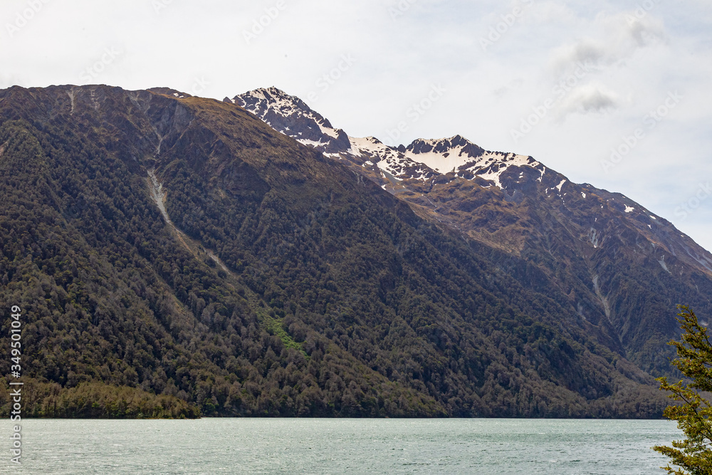 Landscapes of Lake Gunn. Snowy peaks over the lake. New Zealand