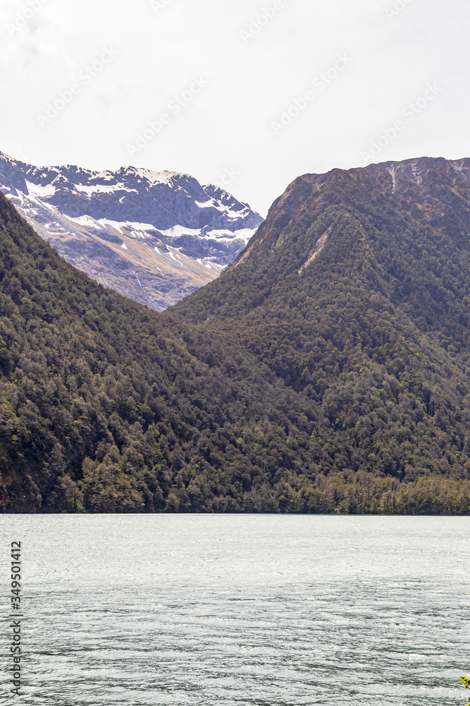 Lake Gunn and the snowy peaks above it. Beautiful lakes of the South Island. New Zealand