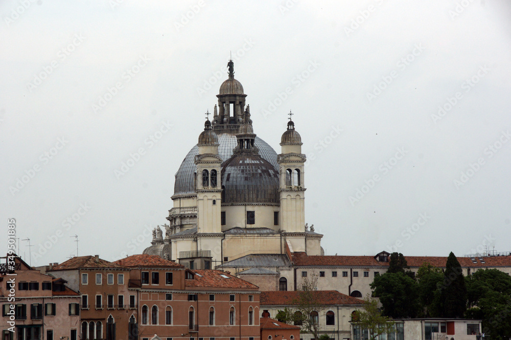 Cityscape with Santa Maria della Salute church, historical facades in Venice. View from the adriatic sea