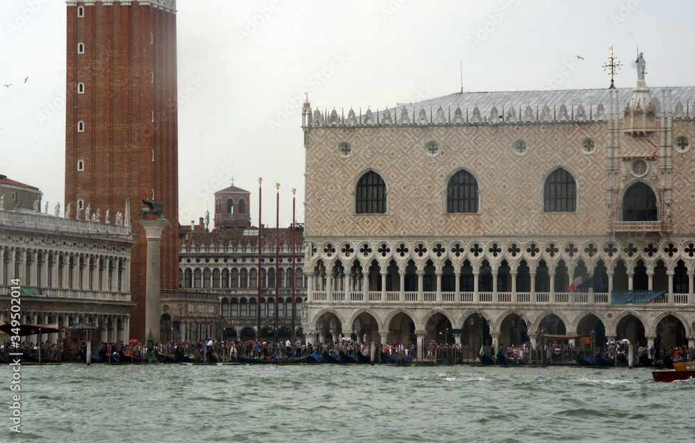 Cityscape with St. Mark's square with campanile, Doge's palace, historical facades in Venice. View from the adriatic sea