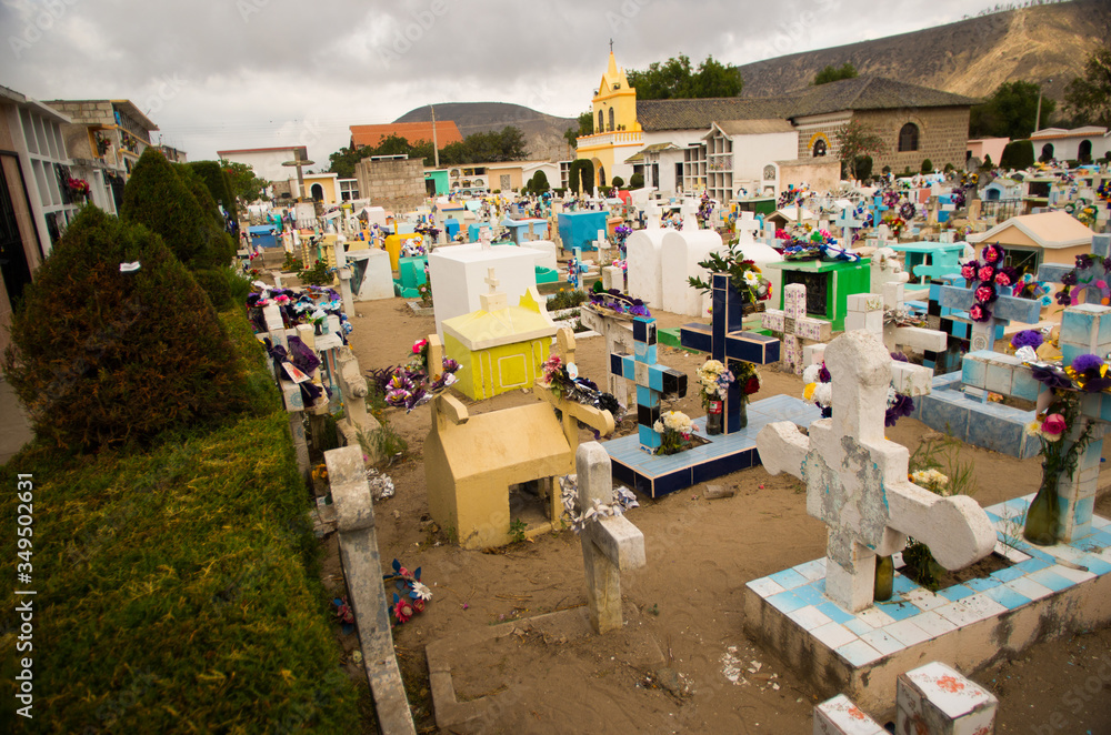 QUITO, ECUADOR- MAY 23, 2017: View of cemetery San Antonio de Pichincha, showing typical catholic graves with large gravestones, mountain background